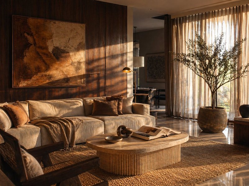 The Greater Kailash House — living room at golden hour